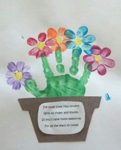 a hand made card with flowers in a pot