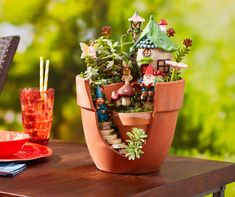 a potted plant sitting on top of a wooden table