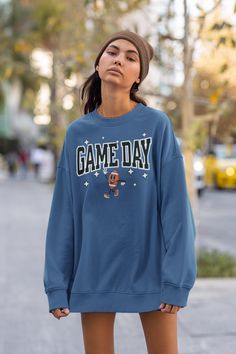 This vintage college inspired crewneck sweatshirt is the perfect gift for the football lover. * Design & Letters are slightly distressed for that vintage inspired look. * UNISEX SIZING * Fits true to size. Size up for a looser fit. * 50% cotton, 50% polyester * Pre-shrunk * Classic fit * 1x1 athletic rib knit collar with spandex * Air-jet spun yarn with a soft feel and reduced pilling * Double-needle stitched collar, shoulders, armholes, cuffs, and hem This product is made especially for you as soon as you place an order, which is why it takes us a bit longer to deliver it to you. Making products on demand instead of in bulk helps reduce overproduction, so thank you for making thoughtful purchasing decisions! Collegiate Sweatshirt For Game Day, Collegiate Crew Neck Sweatshirt For Game Day, Oversized Varsity Sweatshirt For Game Day, Baseball Season Crew Neck Sweatshirt With School Spirit, School Spirit Crew Neck Sweatshirt For Baseball Season, School Spirit Sweatshirt With Crew Neck For Baseball Season, Crew Neck Sweatshirt For Baseball Season With School Spirit, Game Day Football Season Crew Neck Sweatshirt, Football Season Game Day Crew Neck Sweatshirt