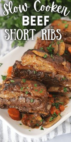 close up of beef short ribs on a plate with carrots and parsley