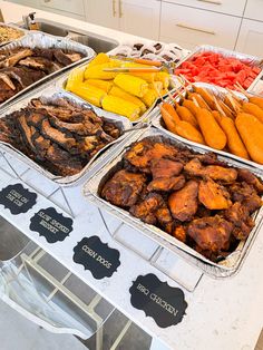 an assortment of different foods on display in trays