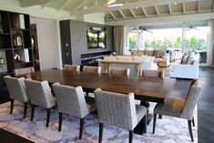 a large dining room table surrounded by chairs