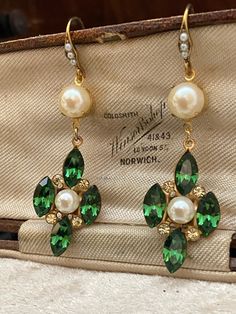 Vintage Green Turmaline & Jonquil Swarowski Crystal  and faux pearl  Drop Pierced Earrings. Lovely quality.  Width at widest point 1.7 cms  Length from the top of the Hook 6 cms.  These have not been worn but are quite old as many years ago we bought the contents of a small company L F Coverdale Est. 1952 that made some of Butler & Wilsons jewellery and this was amongst the treasure trove! I have shown a box in the pictures but it is not part of this sale, it is Presented in a quirky re-cycled m Elegant Green Jeweled Bridal Earrings, Green Drop Pearl Earrings For Wedding, Green Pearl Earrings For Wedding, Victorian Green Earrings For Wedding, Green Jeweled Chandelier Earrings For Wedding, Green Teardrop Pearl Earrings For Wedding, Green Pearl Earrings For Wedding (may Birthstone), Elegant Green Jewelry For Vintage Events, Elegant Dangle Pearl Earrings For May Birthstone