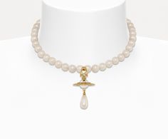 PERFECT FOR ENGAGEMENT, BACHELORETTE, BRIDAL SHOWER, REHEARSAL DINNER, WEDDING, RECEPTION, AND HONEYMOON! Retail: $360 This authentic gold-tone Vivienne Westwood One-Row Pearl Drop choker features a string of glass-based pearls with an iridescent material to simulate natural pearls Pearl drop Crystal-encrusted orb motif Chain length: 37cm Orb dimensions: height 3.5cm, width 2.3cm Weight: 41.7g Vivienne Westwood Ref. Code: 8050568223399 Delivery available in 4-6 business days. Need it sooner? Ema Vivienne Westwood Jewellery, The Vivienne, Pearl Drop, Natural Pearls, Vivienne Westwood, Chain Lengths, Pearl White, The Row, Womens Jewelry Necklace