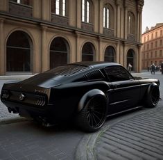 a black car parked on the side of a street