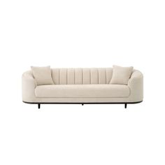 a white couch with black legs and pillows on it's back, against a white background