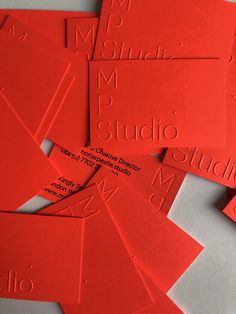 red business cards with the words studio on them