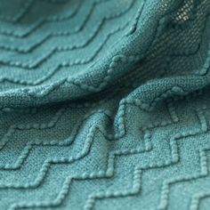 a close up view of a blue blanket