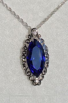 "Stunning Tanzanite Color Cubic Zirconia Marquise Cut, With Sparkle Galore, See Video! These Tanzanite CZs Have Amazing Color! 925 Sterling Silver Curly-Q Pendant With Accent Cubic Zirconia, 20\" Sterling Silver Chain. Chain Length Options Available By Messaging Seller At Time Of Purchase. Gift Box Included." Sapphire Necklaces With Accent Stones For Formal Occasions, Sterling Silver Marquise Necklace For Anniversary, Formal Sapphire Necklaces With Accent Stones, Silver Jewelry With Marquise Gemstone Accents, Silver Marquise Jewelry With Gemstone Accents, Silver Necklace With Cubic Zirconia And Gemstone Accents, Oval Stone Setting Necklaces For Anniversary, Oval Stone Set Necklaces For Anniversary, Elegant Silver Crystal Necklace With Gemstone Accents