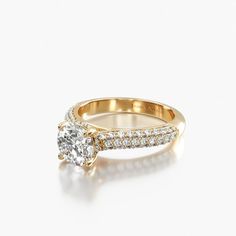 a yellow gold engagement ring with diamonds on the band and an oval cut diamond in the center