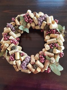 a wreath made out of wine corks on a table