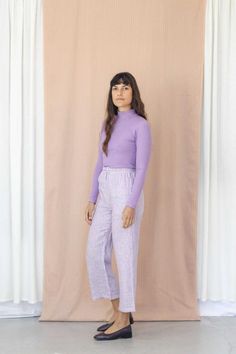 The Grace trousers are back this season in a fresh lilac stripe pure linen. Sitting high on the waist with a flat elastic waistband and drawstring tie. Skimming the hips with internal side seam pockets falling to straight slightly cropped legs, the perfect all rounder relaxed pant. Pair with the matching Bajo Shirt for ultimate resort vibes!Features:- 100% Linen- approx 185gsm- Elastic waistband with drawstring tie- Internal side seam pockets- Handmade in Byron Bay, AustraliaModels are both 5'9 Lavender Wide Leg Cotton Bottoms, Lavender Cotton Pants For Loungewear, Lavender Cotton Loungewear Pants, Lavender Cotton Lounge Pants, High-waist Lavender Pants For Spring, Lavender Pants For Spring Loungewear, Casual Purple Bottoms For Daywear, Spring Lavender Loungewear Pants, Spring Lavender Lounge Pants