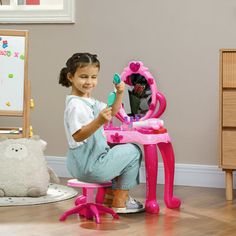 Transform playtime into a glamorous time with the Qaba Kids vanity set. Complete with a stool; this toddler vanity set features a magical mirror that lights up and plays music at the press of a button. The included hair dryer shoots air, adding realism to your kid's pretend makeup sessions. Safe and delightful, it's the dream setup for every aspiring little stylist. Zoomie Kids | Zoomie Kids Vanity Set w / Mirror & Stool, Light & Sound, 15 Accessories in Pink | 27.6" H X 17.1" W X 9.1" D | Wayfa Toddler Vanity, Magical Mirror, Kids Vanity Set, Dream Setup, Pretend Makeup, Mirror Stool, Vanity Set With Mirror, Kids Vanity, The Press