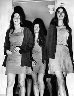 black and white photograph of three women standing next to each other