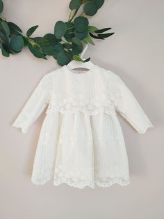 ♡ This is handmade and unique girl dress below knee-length and with long sleeves.  It is comfortable to wear on special occasions. ♡ MADE OF: Ecru delicate fabric with ecru embroidered lace. The lining is made of 100% cotton. ♡ Processing time: 7-10 business days ♡ CARE INSTRUCTIONS: Wash in cold or warm water (30oC/ 65 - 85F). Do not use bleach. Dry at low temperatures, do not use machine drying. Iron at medium or low temperature. Hand wash and hang dry for longer wear. Long Sleeve Baptism Dress With Ruffles, First Communion Spring Dress With Lace Trim, First Communion Lace Patchwork Dress For Spring, Spring First Communion Dress With Lace Patchwork, First Communion Spring Dress With Lace Patchwork, Off White Scalloped Lace Dress, Cream Ruffled Dress For Baptism, Cream Dress With Ruffles For First Communion, Off White Lace Dress With Ruffles