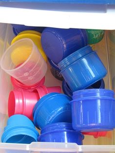 plastic cups and containers in a storage container