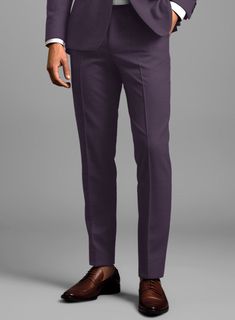 Luxury with a leisure aesthetic takes shape for the perfect man who wants to stand out on every occasion. Crafted with wool and lycra, our Napolean Stretch Purple Wool Tuxedo Suit has a bright purple color with a smooth texture and can be worn on chilly days to keep you warm and help you to look dapper at the same time.  Featuring satin lapel, matching satin covered buttons and gentle texture at its surface, our tuxedo is a subtle fashion-forward take on a traditional tailoring.  Look Includes  Napolean Stretch Purple Wool Fabric  Two Button Tuxedo Jacket Style  Notch Lapel  Black Tuxedo Buttons  Single Vent  Three Cuff Buttons  Two Welted Back Pockets on Trousers   You can change the look by changing the options listed.  Jacket is fully lined while the Pants do not have satin lining.  Lin Tailored Purple Tuxedo, Purple Notch Lapel Tuxedo For Semi-formal Events, Single-breasted Purple Suit For Business, Purple Tailored Suit With Notch Lapel, Tailored Single-breasted Purple Suits, Black Tuxedo, Tuxedo Suit, Tuxedo Jacket, Looking Dapper