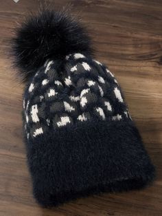 Leopard pattern rib knit beanie with eyelash accents and fluffy faux fur pompom. Black Faux Fur Hat For Fall, Black Faux Fur Hat With Faux Fur Trim, Beanie Black, Rose Boutique, Leopard Pattern, Pom Beanie, Knit Beanie, Rib Knit, Knitted Hats