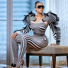 Unleash your wild side with this zebra-inspired strapless jumpsuit featuring a sweetheart neckline and a matching ruffle sleeve shrug, which can be worn together or separately for versatile styling. Made from a stretchy spandex-polyester blend, this jumpsuit offers a sleek bodycon fit that hugs your curves in all the right places. Perfect for making a statement at parties, events, or costume-themed occasions. One size fits most, please refer to the measurements provided below. Zebra Costume Women, African Costume, Native African, Zebra Costume, Outfit Bar, Singer Costumes, Festival Rave Outfit, Plus Size Party, Strapless Bodysuit