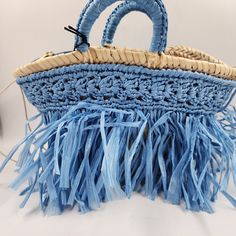 Caterina Bertini Fringe Tote Bag Women'S Mini Blue Interior Zip Pocket Open Top Caterina Bertini Fringe Tote Bag Women's Mini Blue Interior Zip Pocket Open Top Retail $198.00 Elevate Your Bag Game With This Stunning Caterina Bertini Fringe Tote Bag. The Blue Double Handles Are Perfect For Any Occasion, Whether It's A Party Or Casual Day Out. The Trapezoid Shape And Braided Detailing Add A Modern Touch To The Straw Exterior. This Mini Tote Comes With An Interior Zip Pocket And Open Top, Maki Loungefly Purse, Fringe Tote Bag, Trapezoid Shape, Blue Exterior, Bags Game, Mini Blue, Boho Theme, Mini Tote Bag, Western Boho