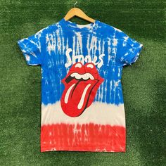 The Rolling Stones No Filter Tour Tie Dye T-Shirt Size Small Measures 18 Inches Pit To Pit 27 Inches Long Amazing T-Shirt Unique Tie Dye Pattern With Graphics On Both Sides Of The Shirt Perfect For Fans Of The Legendary Band The Rolling Stones New Never Worn In Great Condition Blue Screen Print T-shirt For Concert, Multicolor Cotton Top For Concerts, Blue Cotton T-shirt For Concert, Multicolor Band Merch Tops For Summer, Multicolor Casual Tops For Concert, Casual Multicolor Tops For Concert, Blue Band Merch T-shirt, Band Merch Blue T-shirt With Sublimation Print, Blue Fan Merchandise T-shirt For Summer