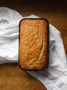 a loaf of bread sitting on top of a white napkin