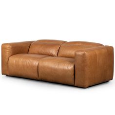 a brown leather couch sitting on top of a white floor