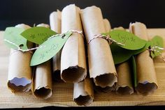 several rolled up brown paper with green leaves on them