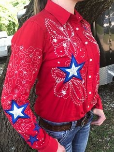 Be the talk of the Rodeo crowd with your beautifully patriotic and unique AJD Custom Design Embroidered shirt. You supply the shirt we do the embroidery and stoning. WE MAKE THESE TO ORDER. We love to make custom orders. 🤩 Note: $20.00 Shipping Cost Includes $4.00 for Insurance. Rodeo Queen Shirts Diy, Western Style Red Long Sleeve Tops, Red Western Long Sleeve Tops, Red Long Sleeve Western Top, Red Long Sleeve Top For 4th Of July, Red Long Sleeve Tops For 4th Of July, Patriotic Fitted Top, Patriotic Red Shirt For 4th Of July, Red Americana Tops With American Flag Print