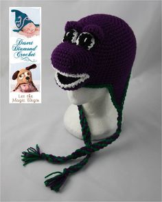 a crocheted hat with a dog's face on the front and side