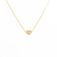 Get your hands on our Petite Heart Necklace by Kimberly James Jewelry! Perfect for any occasion, this stunning necklace is a must-have for your everyday wardrobe. Add a touch of love and style to your look with this piece. Details: Gold Plated over Brass E-coating for durability Classic Heart-shaped Necklace As A Gift For Her, Dainty Everyday Necklaces With Heart Detail, Classic Heart-shaped Clavicle Chain Necklace, Heart Shaped Everyday Necklaces With Adjustable Chain, Heart-shaped Everyday Necklace With Adjustable Chain, Minimalist Necklace With Heart Pendant Detail, Heart Necklace With Adjustable Chain For Everyday, Minimalist Necklace With Open Heart And Heart Beads, Minimalist Necklace With Heart Detail For Everyday