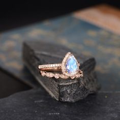 "Rose Gold Moonstone Engagement Ring Pear Shaped Ring Bridal Set Diamond Halo Women Antique Ring Anniversary Gift Mothers Day Gift Drop Tear This listing sells the bridal set, includes the main ring and matching band. Check the main ring here: https://www.etsy.com/listing/563656478 Check the matching band here: https://www.etsy.com/listing/551290406 ITEM INFORMATION Metal Type - Solid 14k Rose Gold Band Width - (approx.. 1.4mm) Center Stone - 6*8mm Pear Cut Natural Moonstone Side Stone - Natural Pear-shaped Moonstone Gemstone Ring, Wedding Moonstone Rings With Stone Setting, Pear-shaped Moonstone Ring For Wedding, Teardrop Moonstone Wedding Ring, Wedding Moonstone Ring With Pear-shaped Gemstone, Pear-shaped Moonstone Wedding Jewelry, Anniversary Pear-shaped Moonstone Ring, Gold Moonstone Engagement Ring, Engagement Ring Pear Shaped