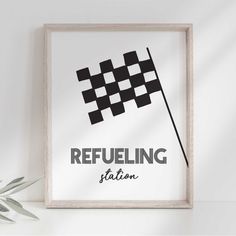 a black and white checkered flag with the words refueling station