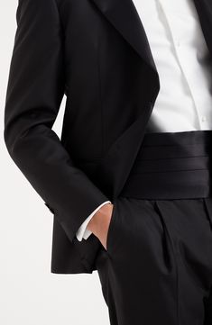 The cotton and silk satin employs the same fabric that decorates the tuxedo lapels, with a smooth texture and slightly shiny effect. Adjustable slide fastening Evening Fitted Tuxedo With Hidden Button Closure, Fitted Tuxedo With Hidden Button Closure For Evening, Elegant Tailored Tuxedo With Hidden Button Closure, Elegant Evening Silk Suits, Classic Evening Suits For Gala, Tailored Satin Elegant Suit, Black Silk Tuxedo With Pressed Crease, Classic Satin Suits For Semi-formal Occasions, Fitted Silk Suit For Black-tie Events