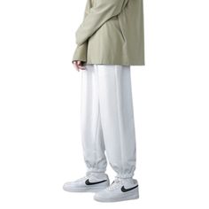 The Baggy Wide Leg Casual Sweatpants are the ideal winter companion for men who want functionality and flair in their wardrobe. Made from high-quality fabrics, these pants offer a comfortable and toasty fit, making them suitable for the chilly season. But that's not all! You won't ever have to worry about carrying your essentials separately because of the numerous compartments that were thoughtfully positioned throughout the design. Specifications: Applicable Season: Spring and Autumn Applicable Casual Winter Leisure Bottoms, Relaxed Fit Full Length Pants For Winter, White Baggy Pants For Outdoor, Full Length Relaxed Fit Pants For Winter, Winter Full Length Pants With Relaxed Fit, Winter Full Length Relaxed Fit Pants, Full Length Bottoms For Leisure In Winter, Winter Full Length Bottoms For Leisure, Casual Baggy Parachute Pants For Winter