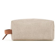 Indulge in the quiet luxury of this minimally-minded travel pouch. Made from a lightweight linen blend, this carry on–worthy style is finished with a whimsical poly lining so you can tote your toiletries with confidence. Designed with an internal zip pocket for stowing your smallest sundries—and a side loop handle for easy carrying or hanging from a hook—no detail is overlooked in the design of this jet-set essential. Mini Pouches, Quiet Luxury, Envelope Clutch, The Sak, A Hook, Small Cards, The Quiet, Wristlet Wallet, Travel Pouch