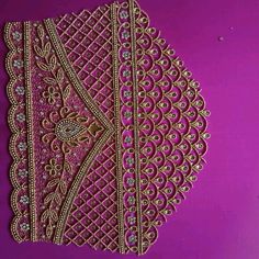 an intricately designed piece of cloth on a purple background