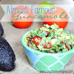 an avocado and tomato salad in a bowl with the words almost famous guacamole