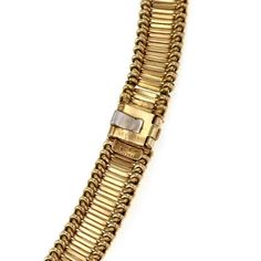 "This is a beautiful authentic vintage collar necklace from Cartier. It is crafted from 18k yellow gold with a polished finish and features double side small strips in a bridge like style bodered with a woven chain design. The necklace is 10mm wide and it secures with a hoop in snap shut clasp and latch for added security. It is signed by the designer with the metal content. Material: 18k yellow gold Hallmark: Cartier Made in France 18k Measurements: 16\" long x 10mm wide x 3.1mm high Weight: 60 Fancy Collar, France Vintage, Woven Chain, Bib Necklaces, Chain Design, A Bridge, Collar Necklace, Cartier, Hallmark