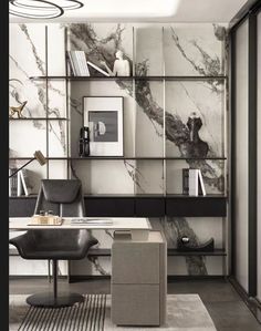 an office with marble walls and black furniture