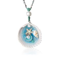 a necklace with shells and pearls on it