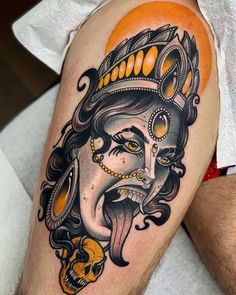 a man's leg with a tattoo on it that has an image of a woman