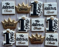 decorated cookies with the number one and crown on them for a first birthday or baby shower