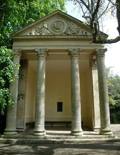 an old building with columns and a door