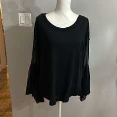 Very Cute And Comfy Oversized Black Free People Brand Blouse,Brand New No Tags,Fits Medium And Large Because Of The Style Chic Black Long Sleeve Top With Sheer Sleeves, Black Blouse With Sheer Long Sleeves, Fall Black Blouse With Sheer Sleeves, Trendy Black Blouse With Sheer Sleeves, Casual Black Blouse For Layering, Black Blouse With Sheer Sleeves For Fall, Fall Black Top With Sheer Sleeves, Chic Black Blouse With Bell Sleeves, Black Stretch Long Sleeve Top With Sheer Sleeves