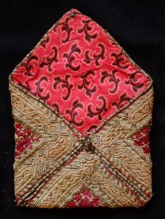 This is a beautiful metallic embroidered Uzbek pouch.  The inner lining is in a cotton block printed material.  The workmanship is exquisite.    -Metallic embroidery-Cotton block printed lining Traditional Red Pouch, Traditional Embroidered Pouch For Festivals, Traditional Pouch With Intricate Embroidery For Festivals, Traditional Festival Pouch With Intricate Embroidery, Traditional Pouch With Gold Embroidery, Traditional Ceremonial Bags With Gold Embroidery, Traditional Gold Embroidered Ceremonial Bags, Traditional Pouch With Gold Embroidery For Festive Occasions, Traditional Gold Embroidered Pouch For Festive Season