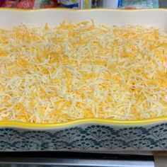 a casserole dish is covered with cheese and ready to go into the oven