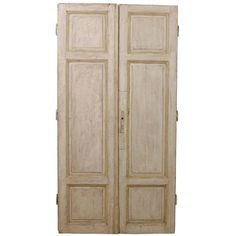 an old wooden double door on a white background