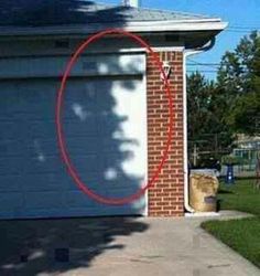 a red circle is in front of a brick house with the word david - sylvan on it