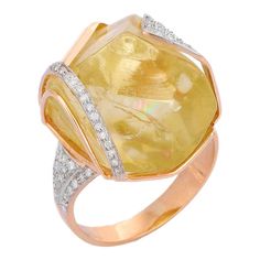 This is part of Chairish’s Fine Jewelry assortment.  Embrace boho chic with this stunning 14K gold ring, featuring a rough lemon topaz in a captivating flower shape. Its art deco design is complemented by dazzling diamonds, making it a standout statement piece. Perfect for holiday glamour, this ring is a brilliant choice for Make a Statement Look. yellow Topaz soothes, heals, stimulates, recharges, re-motivates your partner and aligns the meridians of the body – directing energy to where it is needed most.  Designed with Big yellow Topaz in center and lines of diamonds that makes it a perfect fit to wear it on your wedding or style it with any of your basic outfit to give it a glam.  PRODUCT DETAILS :-   Material - 14K Solid Yellow Gold  Gemstone - Yellow Topaz  Gemstone Weight - 37.70 ct Yellow Topaz Ring With Gemstone Accents, Elegant Yellow Topaz Ring With Gemstone Accents, Luxury Yellow Topaz Ring With Diamond Accents, Luxury Yellow Topaz Ring With Diamonds, Luxury Yellow Rings With Rose Cut Diamonds, Yellow Hallmarked Topaz Rings, Yellow Topaz Ring With Polished Finish, Luxury Yellow Topaz Ring With Polished Finish, Yellow Topaz Ring, Round Cut Fine Jewelry